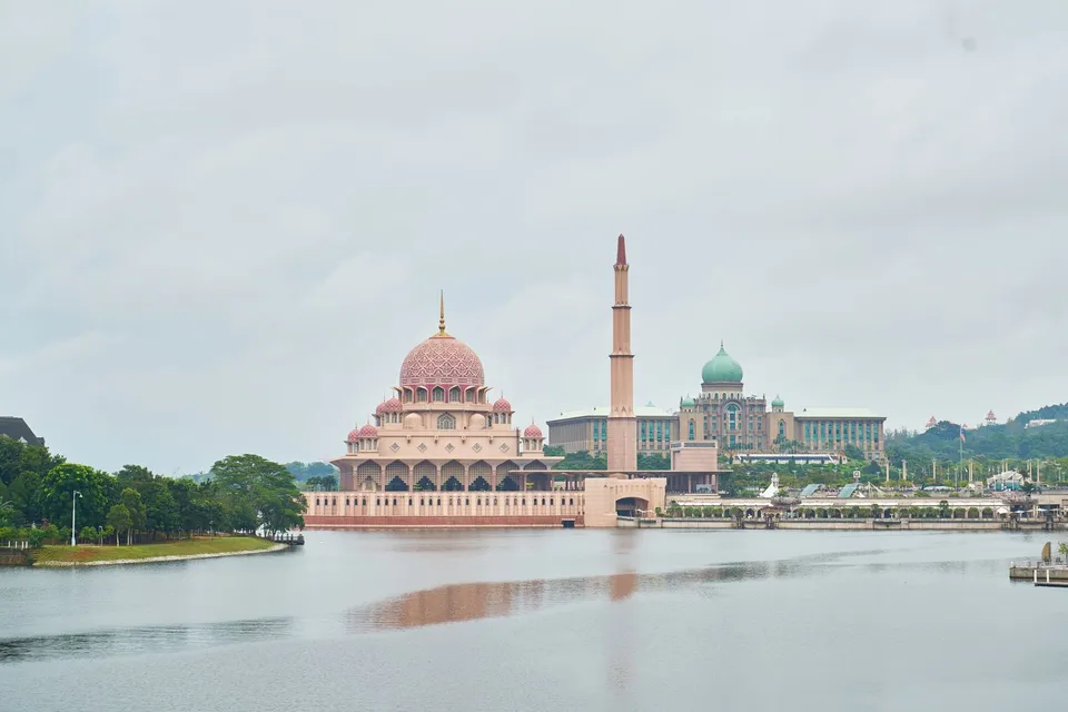 Putra Mosque and Perdana Putra reflected beside Putrajaya Lake in Malaysia