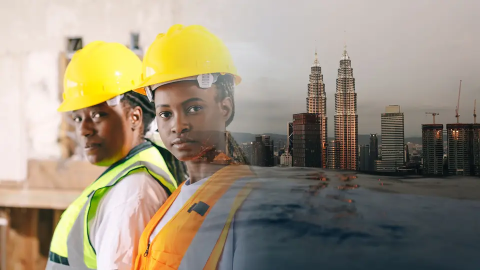 Composite of construction professionals in hard hats blended with the Kuala Lumpur skyline and Petronas Twin Towers